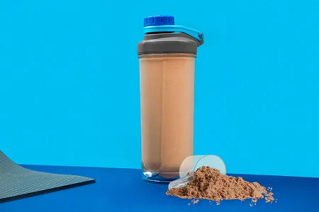 Creamy chocolate protein shake prepared for post-workout nutrition