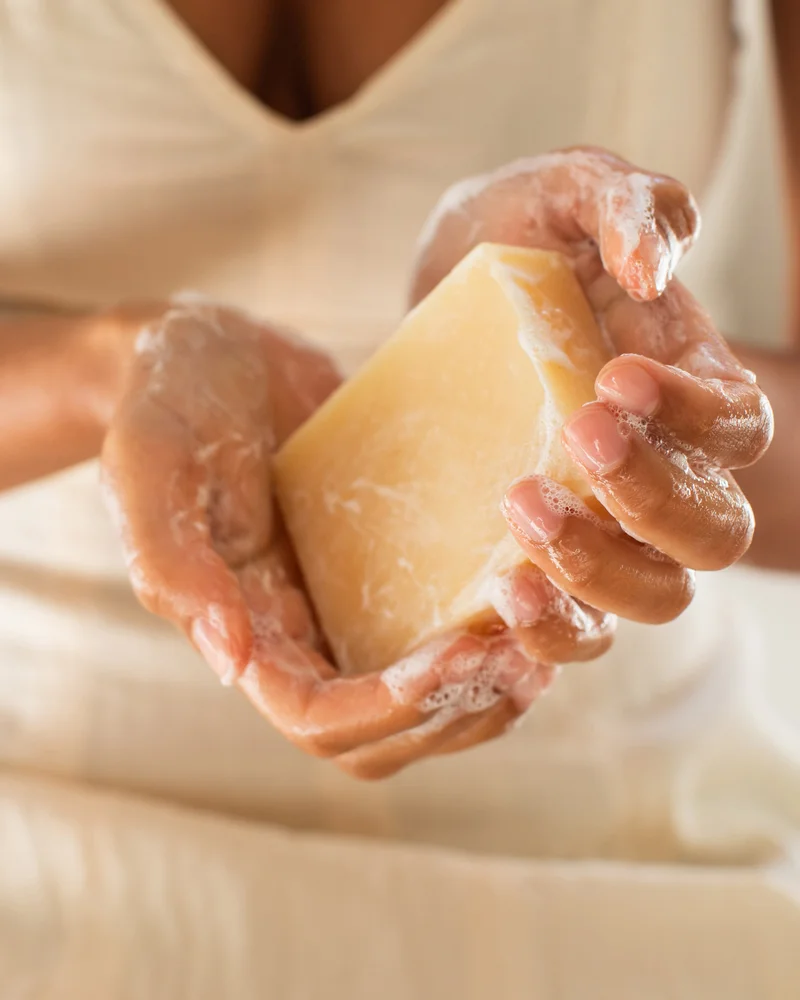 Two white hands washing with a creamy soap