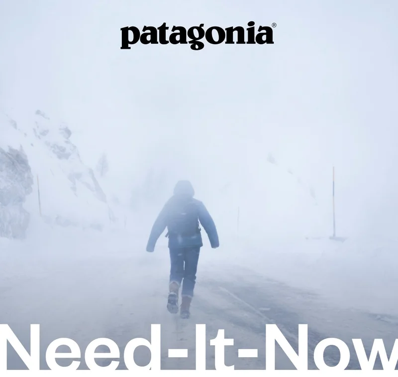 A person walks on a road during a white out.