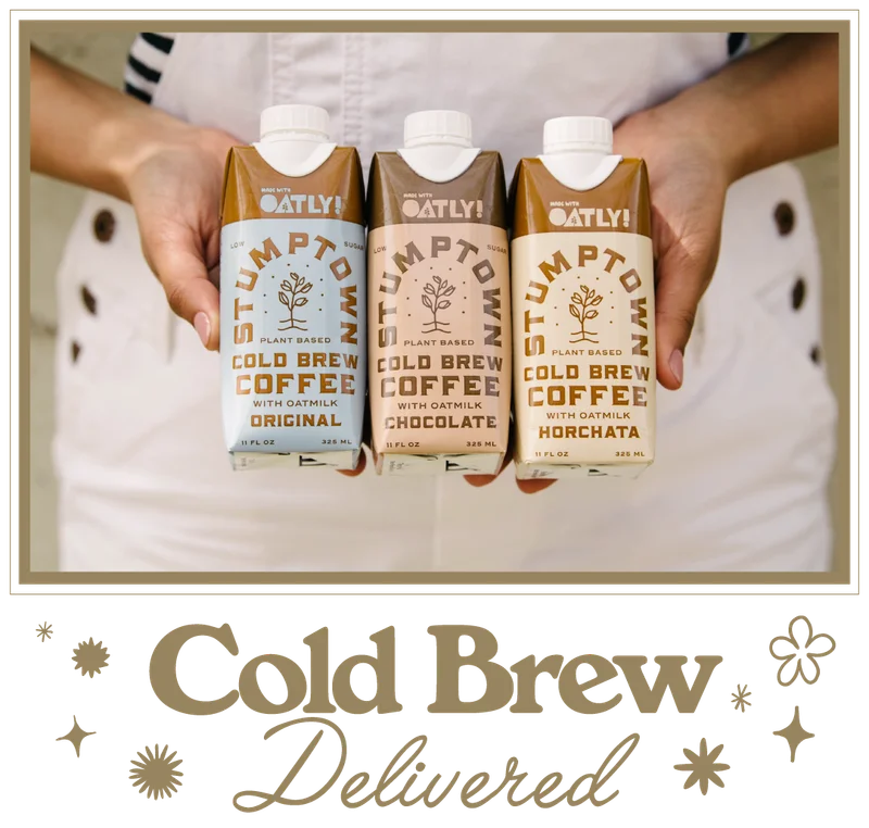Hands holding three Stumptown cold brew cartons with oat milk—Original, Chocolate, and Horchata—with the headline “Cold Brew Delivered” below.