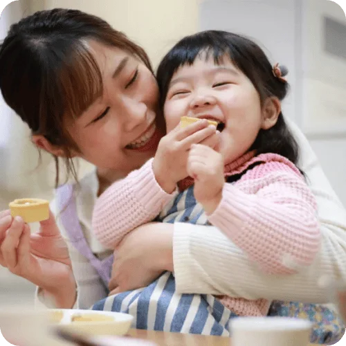 a mom and toddler girl having dietitian-approved toddler snacks a mom and toddler girl having dietitian-approved toddler snacks