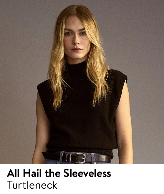 A woman wearing a black, sleeveless turtleneck top.
