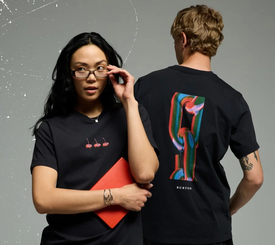 Image of a male and female model wearing the new board graphic tees.
