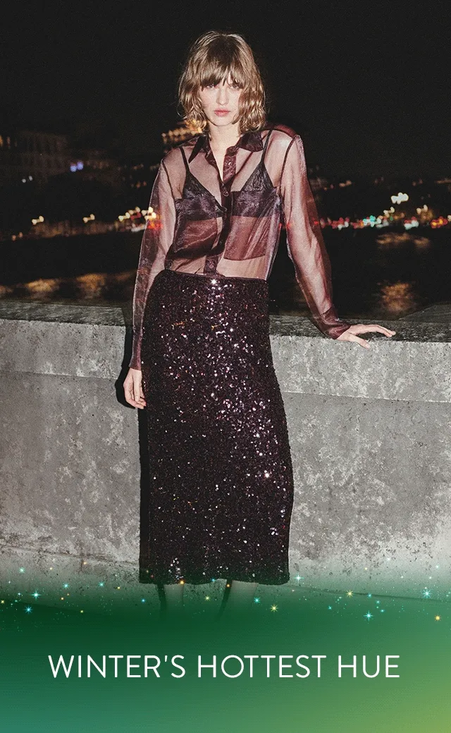 Women wearing festive, burgundy-colored outfits from MANGO.