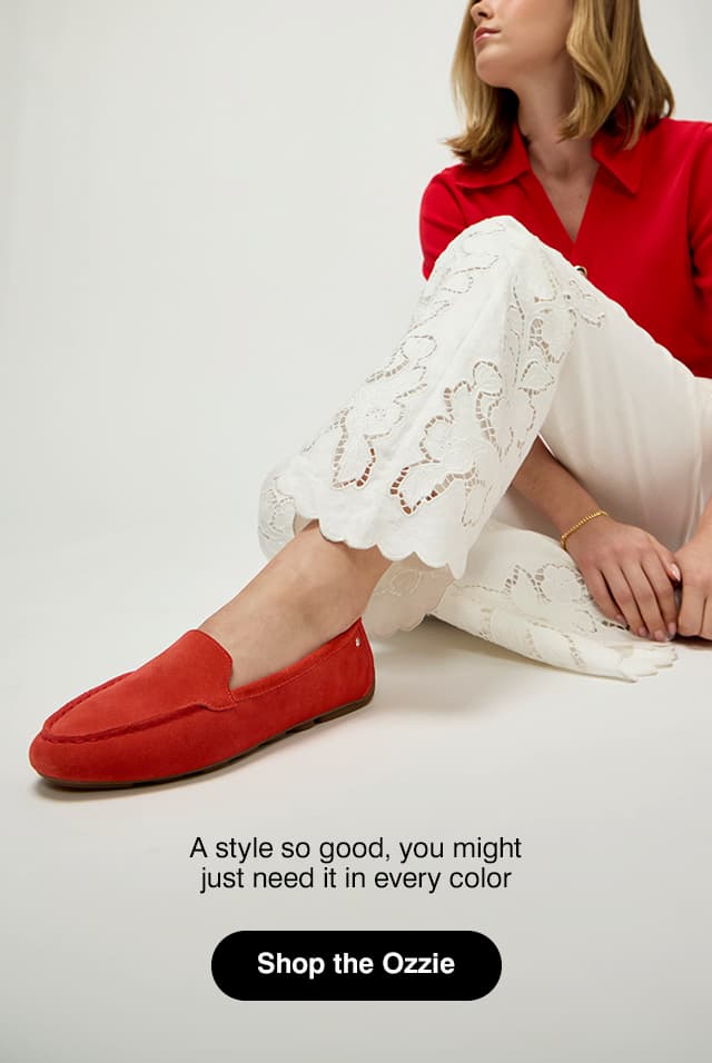 A side view of the Rovie in Orange leather on foot. Shop Ozzie