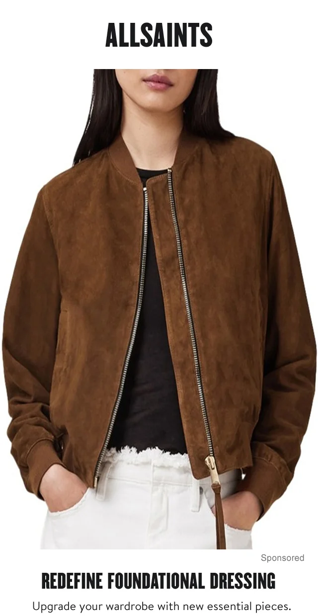 A woman wearing a suede jacket and white fringe-waist jeans.
