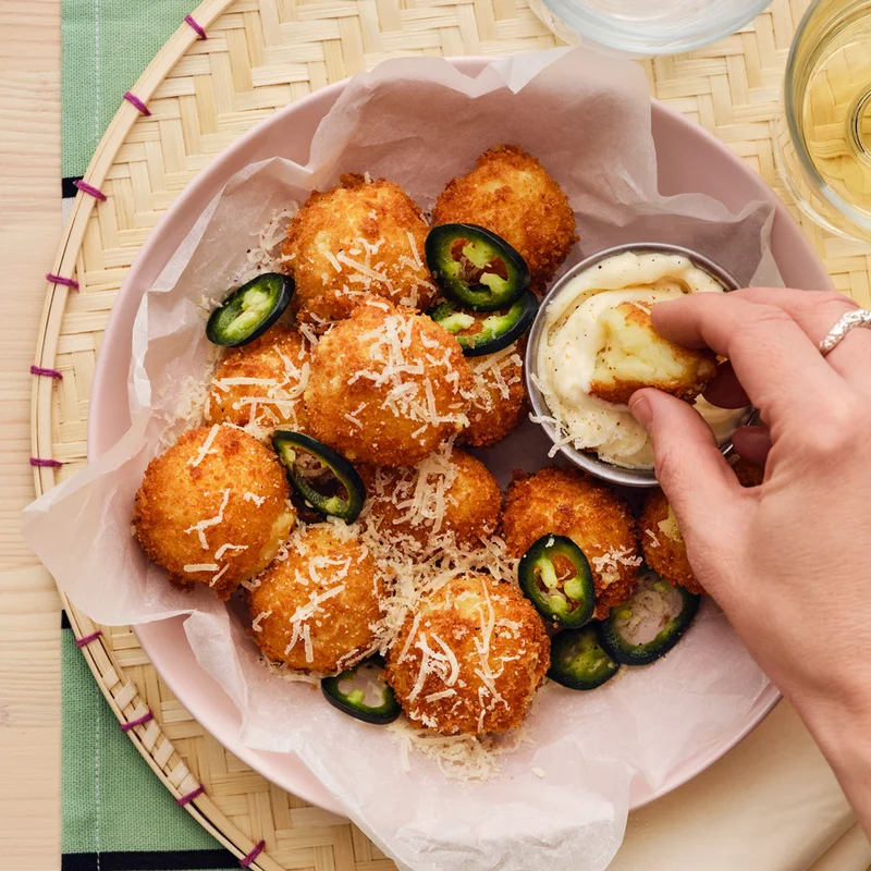 Bowl of potato croquettes and dip.