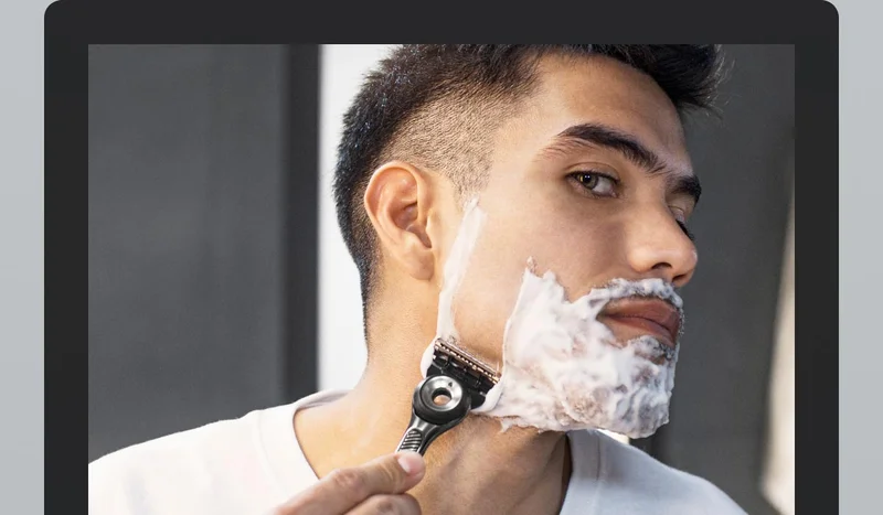 Man shaving his face
