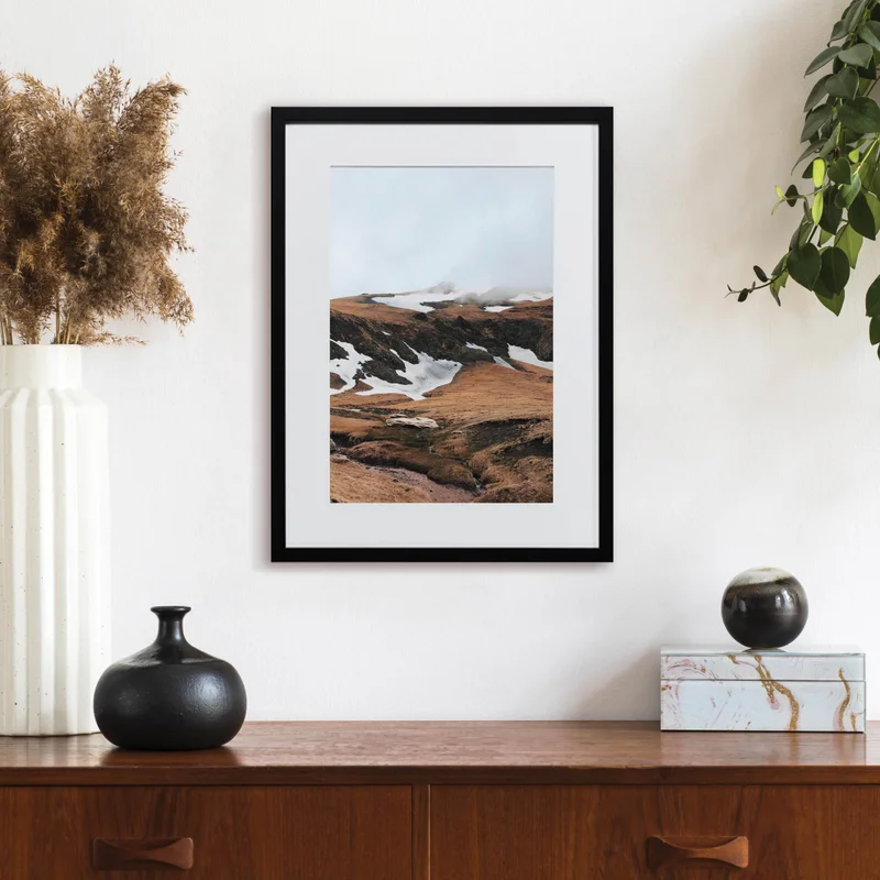 Framed print of mountains.