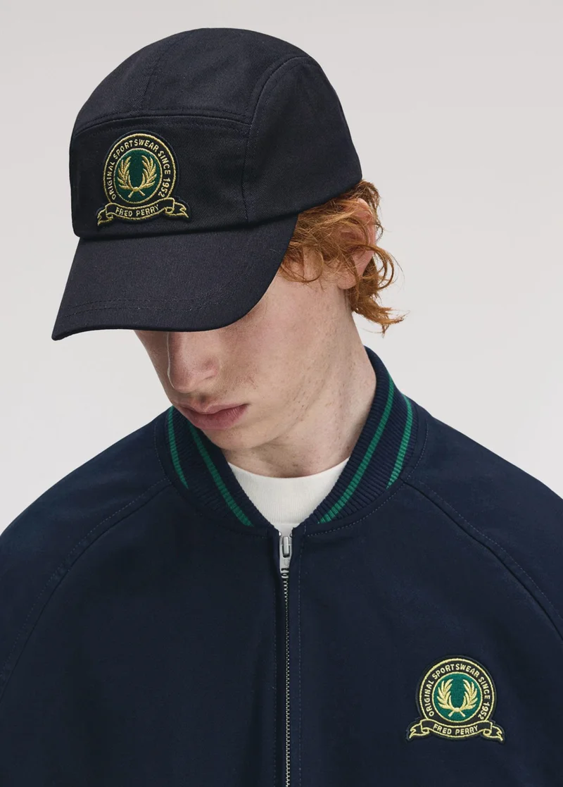 Male model wearing a Fred Perry Tennis Badge Twill Cap