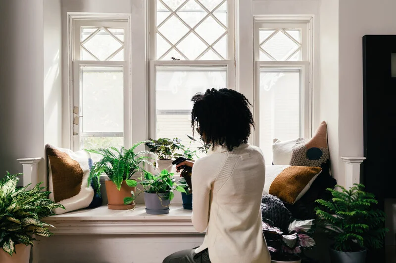 woman caring for plants
