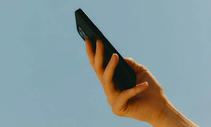Close-up of a person's hand holding a smart phone