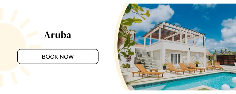 Lounge poolside in a breezy private villa just steps from the sand in Aruba.