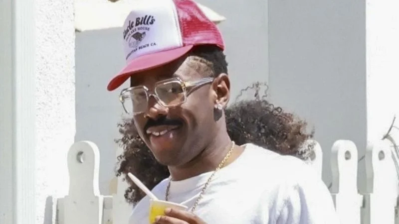 Image may contain: Tyler, The Creator, Face, Head, Person, Smoke, Adult, Car, Transportation, Vehicle, and Accessories