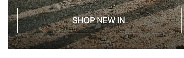 Rough, earthy brown and beige ground texture with a white 'SHOP NEW IN' button. Click to discover new collection items and latest arrivals.