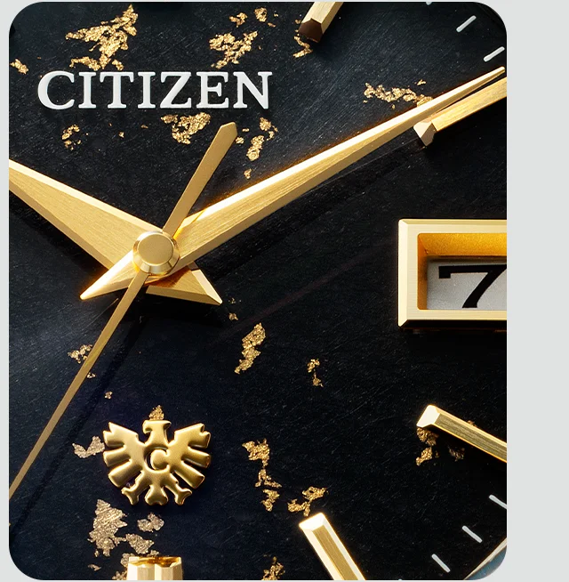 A detail shot showcasing the flecking of gold and silver flakes on the dial