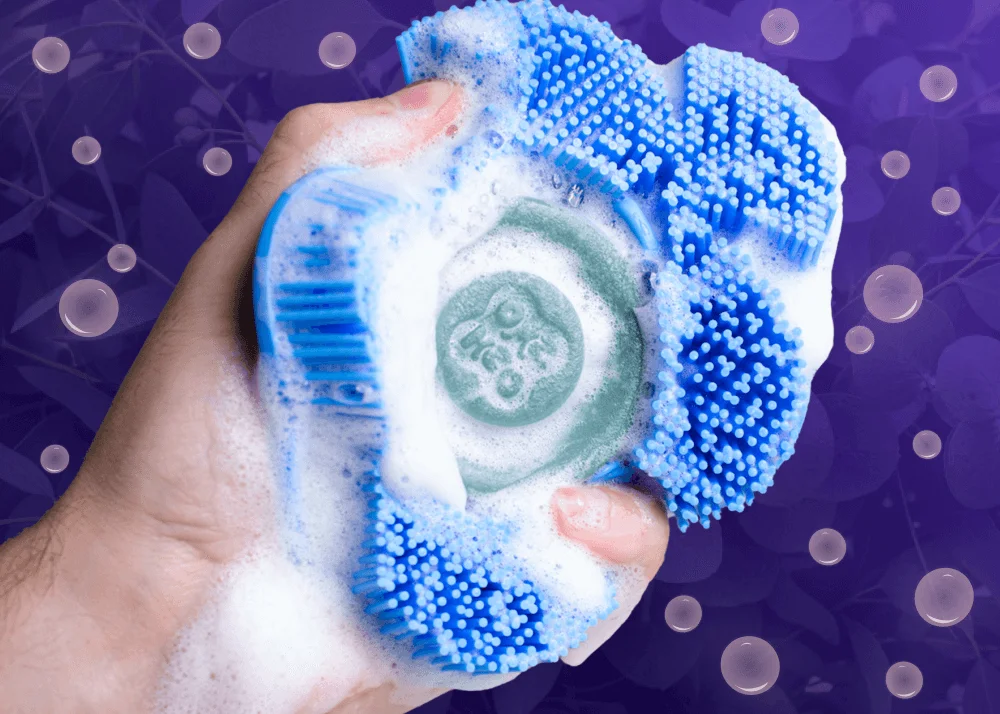 A blue Smoosh scrubber with eucalyptus bar embedded.