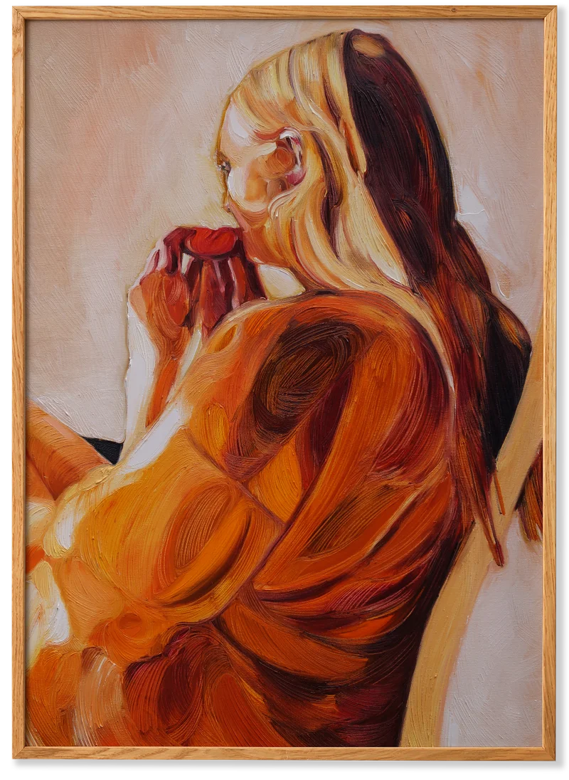 Woman hanging an art print