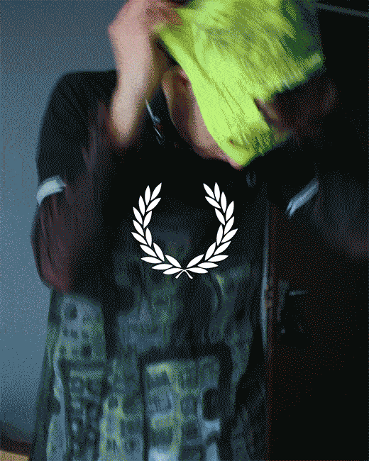 Fred Perry Ambassador GIF of the ambassador getting ready and styling Fred Perry Shirts