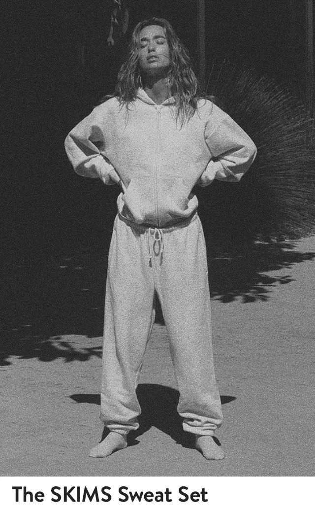 Women model cotton fleece sweatpants and sweatshirts from SKIMS.