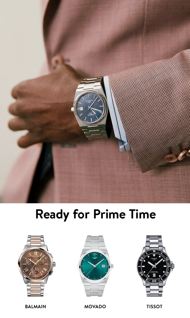 A man wearing a watch. A Balmain watch. A Movado watch. A Tissot watch.