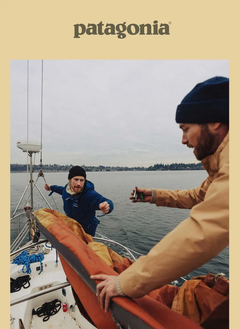 Patagonia. Two people working on a sailboat.