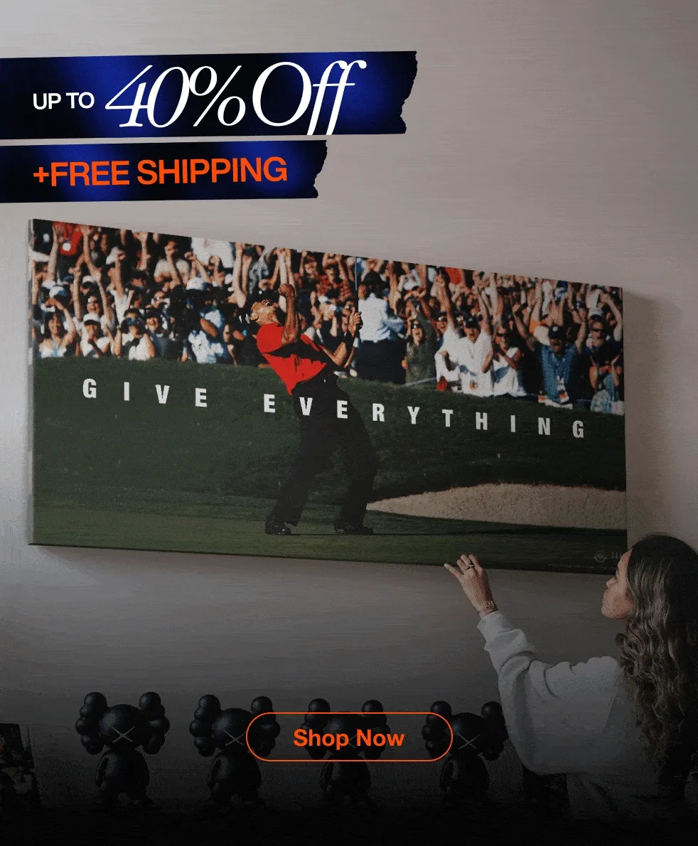 Black Friday Sale promotional GIF showcasing various IKONICK canvas art pieces displayed in stylish home interiors. Each frame features a different motivational artwork — including Snoopy and Woodstock saying ‘Keep Looking Up,’ Tiger Woods celebrating with the quote ‘Give Everything,’ Michael Jordan mid-dunk with ‘Tell Me I Can’t,’ a vintage scoreboard reading ‘Yesterday’s Hits Won’t Win Today’s Games,’ the Roman Colosseum piece titled ‘Man in the Arena,’ and the Monopoly-inspired artwork labeled ‘Success – Price of Entry.’ Overlaid text highlights ‘30% Off Sitewide’ and ‘40% Off Over $500 + Free Shipping,’ with a ‘Shop Now’ button at the bottom. Black Friday Sale promotional GIF showcasing various IKONICK canvas art pieces displayed in stylish home interiors. Each frame features a different motivational artwork — including Snoopy and Woodstock saying ‘Keep Looking Up,’ Tiger Woods celebrating with the quote ‘Give Everything,’ Michael Jordan mid-dunk with ‘Tell Me I Can’t,’ a vintage scoreboard reading ‘Yesterday’s Hits Won’t Win Today’s Games,’ the Roman Colosseum piece titled ‘Man in the Arena,’ and the Monopoly-inspired artwork labeled ‘Success – Price of Entry.’ Overlaid text highlights ‘30% Off Sitewide’ and ‘40% Off Over $500 + Free Shipping,’ with a ‘Shop Now’ button at the bottom.
