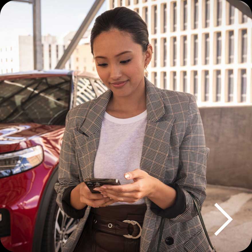 A woman using the FordPass App.