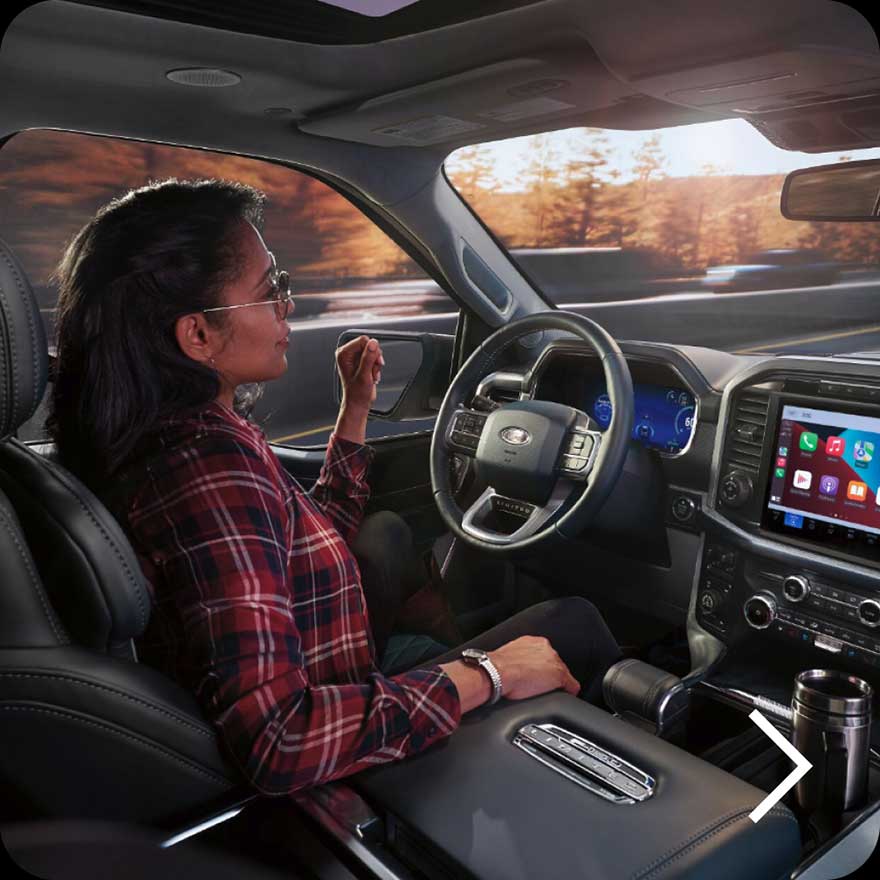 A woman using Ford BlueCruise.