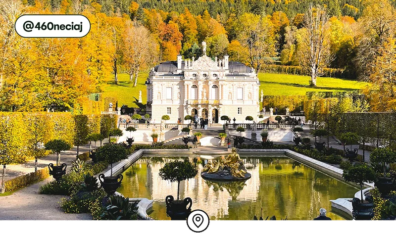 Image description: Yellow fall foliage and Linderhof Palace in Bavaria, an hour from Munich, photo taken by @460neciaj