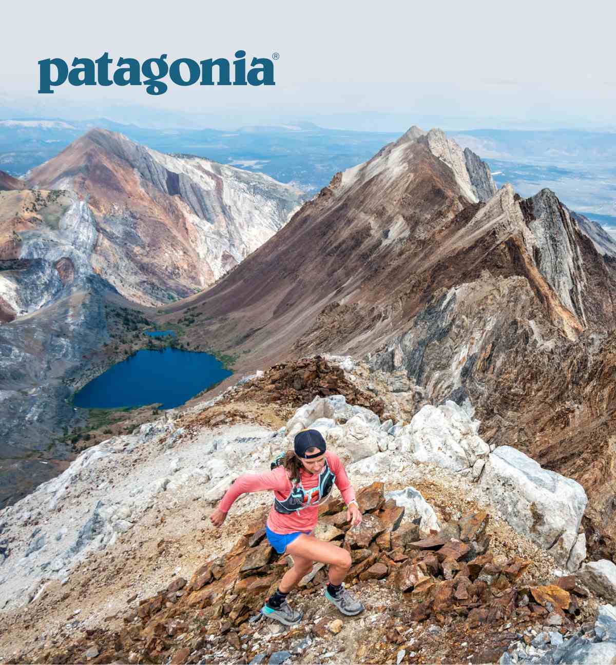 Patagonia. A person, wearing a long-sleeved top, running in the mountains.