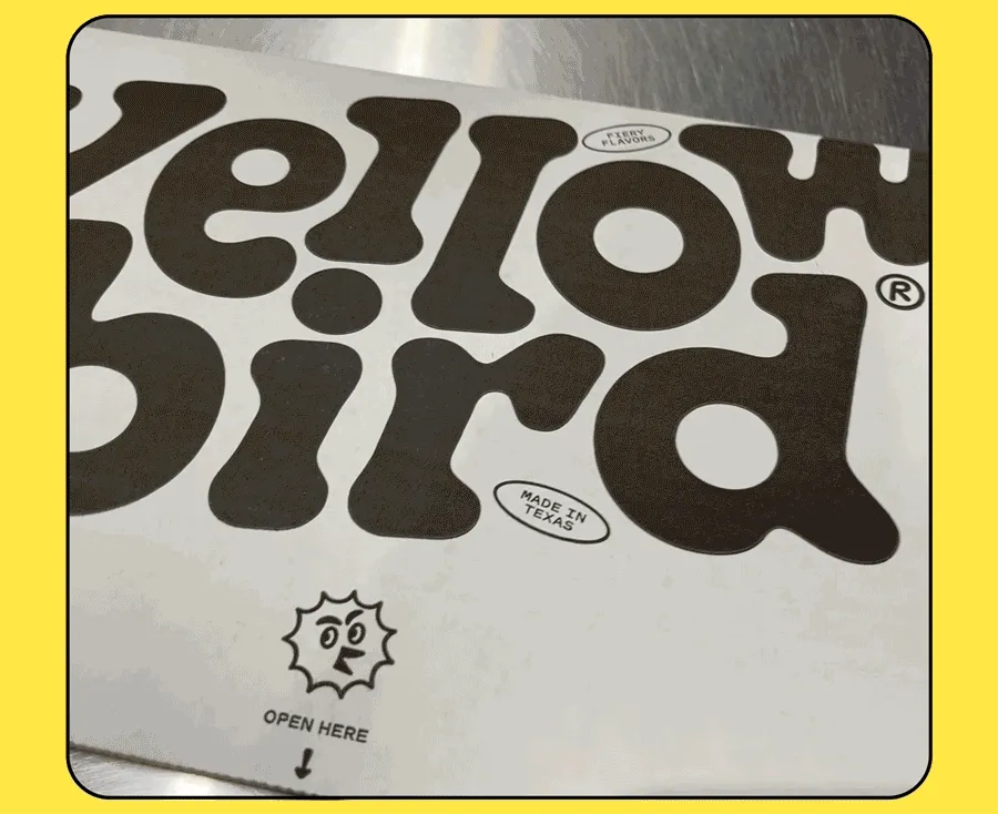 GIF of box opening to reveal Yellowbird Mini Comic