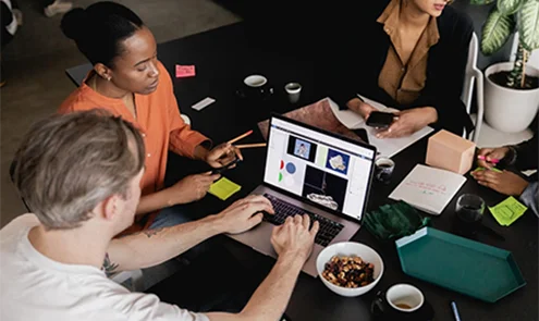 People co-working at a table People co-working at a table