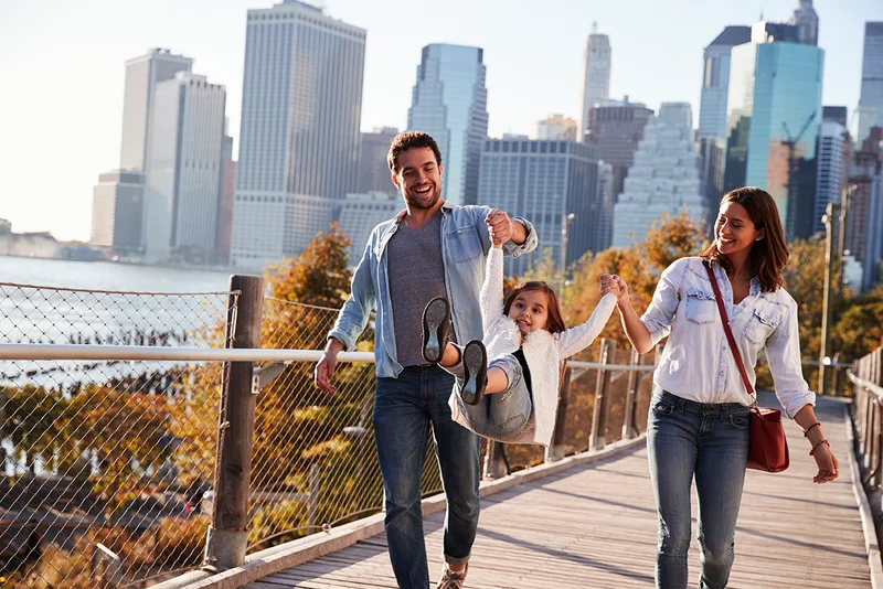 A couple and child walking in New York City