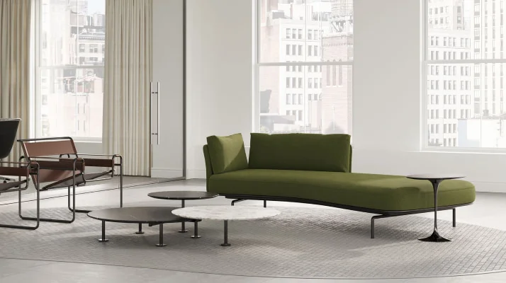 A private office with a lounge setting consisting of a Panoramic Sofa, two Wassily Chairs and Grasshopper tables set.