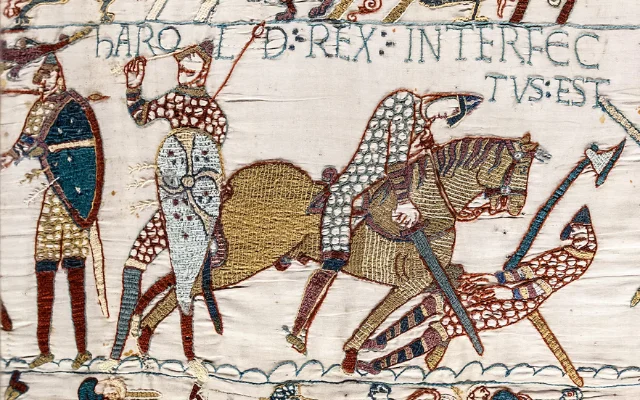 Here, A segment of the Bayeux Tapestry showing King Harold being killed with a sword.