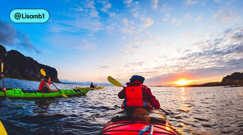 Image description: Two two-person kayaks in the ocean at sunset, photo taken by @Lisamb1