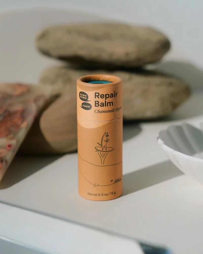 A brown tube arranged with river stones