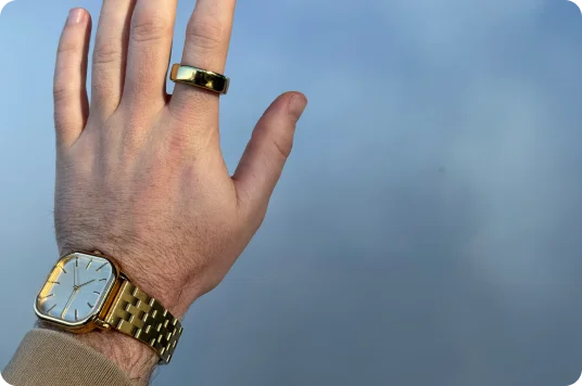 Hand wearing Oura Ring and watch