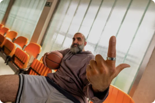 Person holding a basketball wearing Oura Ring
