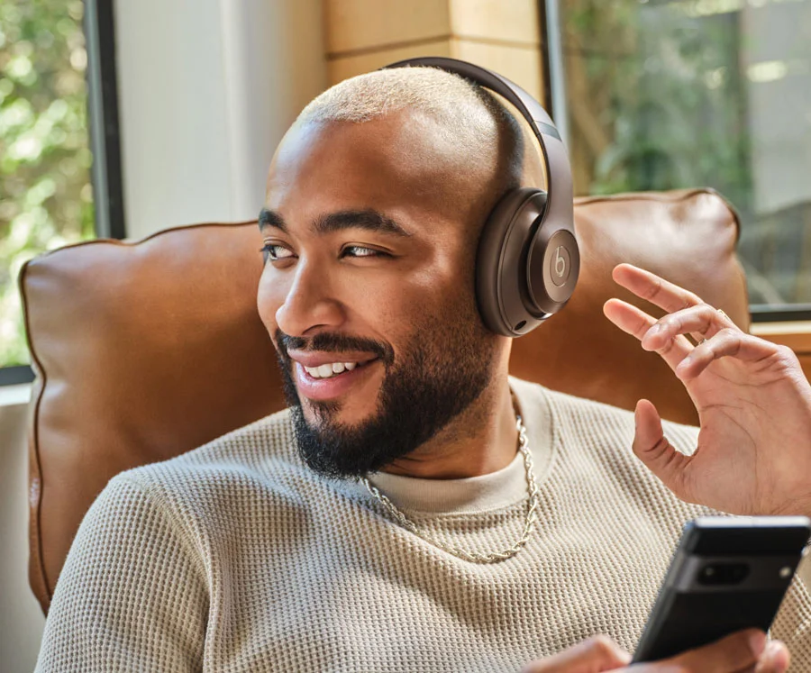 Person wearing Beats Solo Buds in Deep Brown