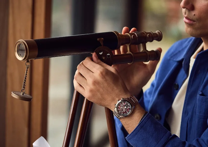 Man with a small telescope wearing BY1010-81Z