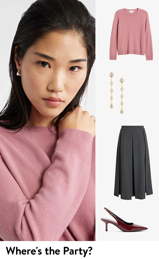 A woman wearing a pink sweater; the sweater, earrings, skirt and heels.