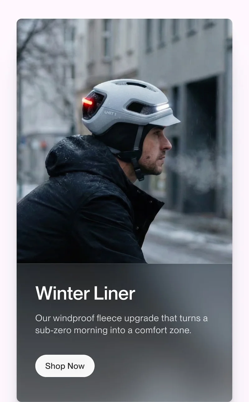 Rider wearing a UNIT 1 helmet and winter liner in cold weather, with copy about windproof fleece comfort for freezing mornings