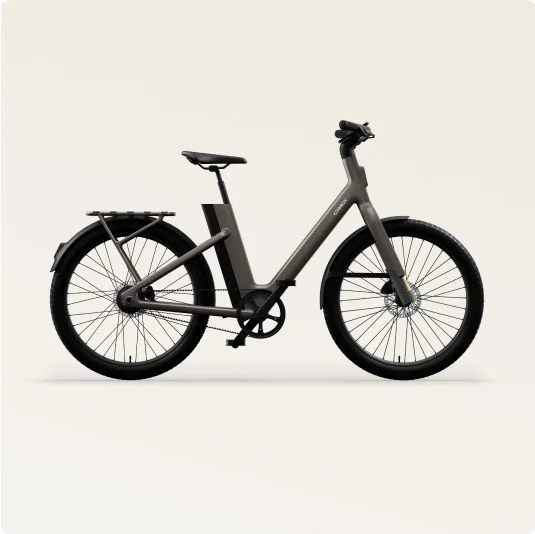 Side view of the Cowboy Cross ST e-bike in Mushroom, with a step-through frame for accessibility and integrated components.