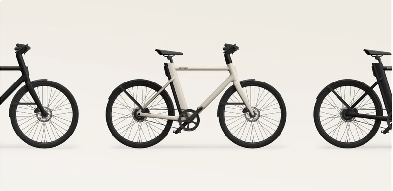 Side view of the Cowboy Cruiser e-bike in Sand, showcasing its sleek and minimalist frame design.