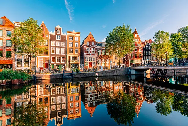 Amsterdam’s famously skinny townhouses are best discovered on a walking tour along the canals.