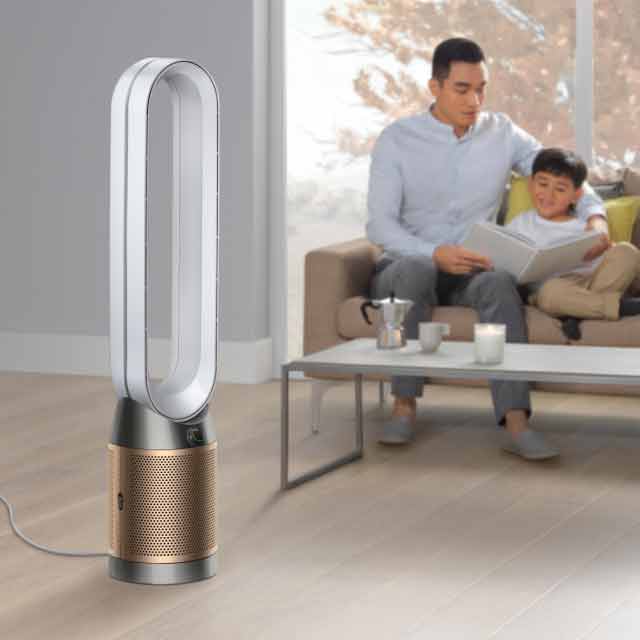 A family next to a Dyson purifier.