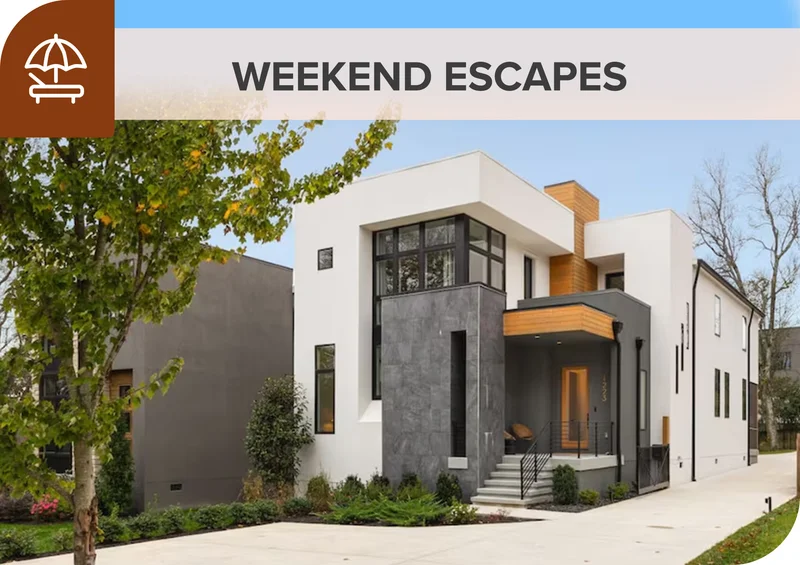 Modern home with clean lines and warm accents set among trees, ideal for a quick weekend escape.
