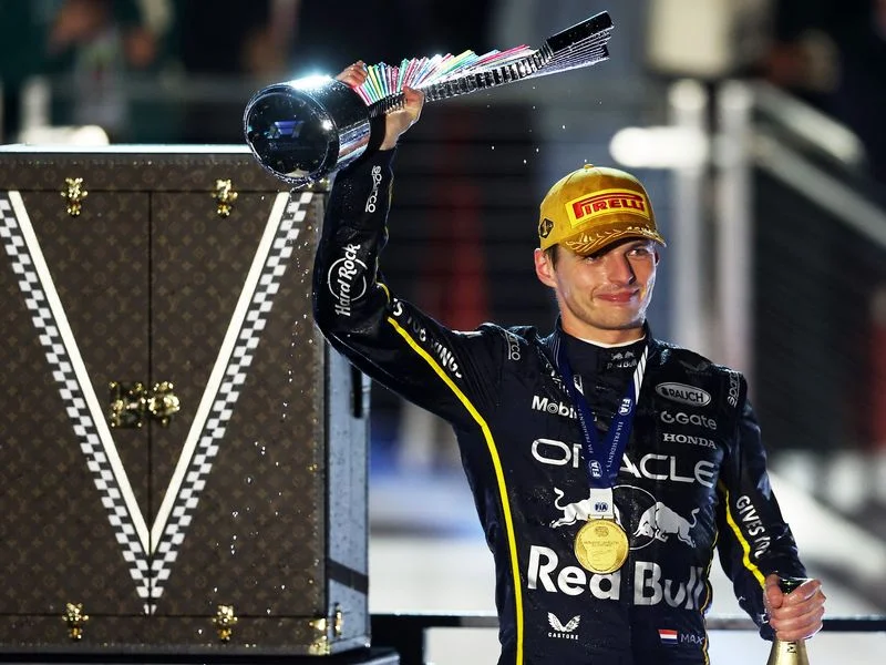 LAS VEGAS, NEVADA - NOVEMBER 22: Race winner Max Verstappen of the Netherlands and Oracle Red Bull Racing lifts his trophy on the podium during the F1 Grand Prix of Las Vegas at Las Vegas Strip Circuit on November 22, 2025 in Las Vegas, Nevada. (Photo by Chris Graythen/Getty Images)